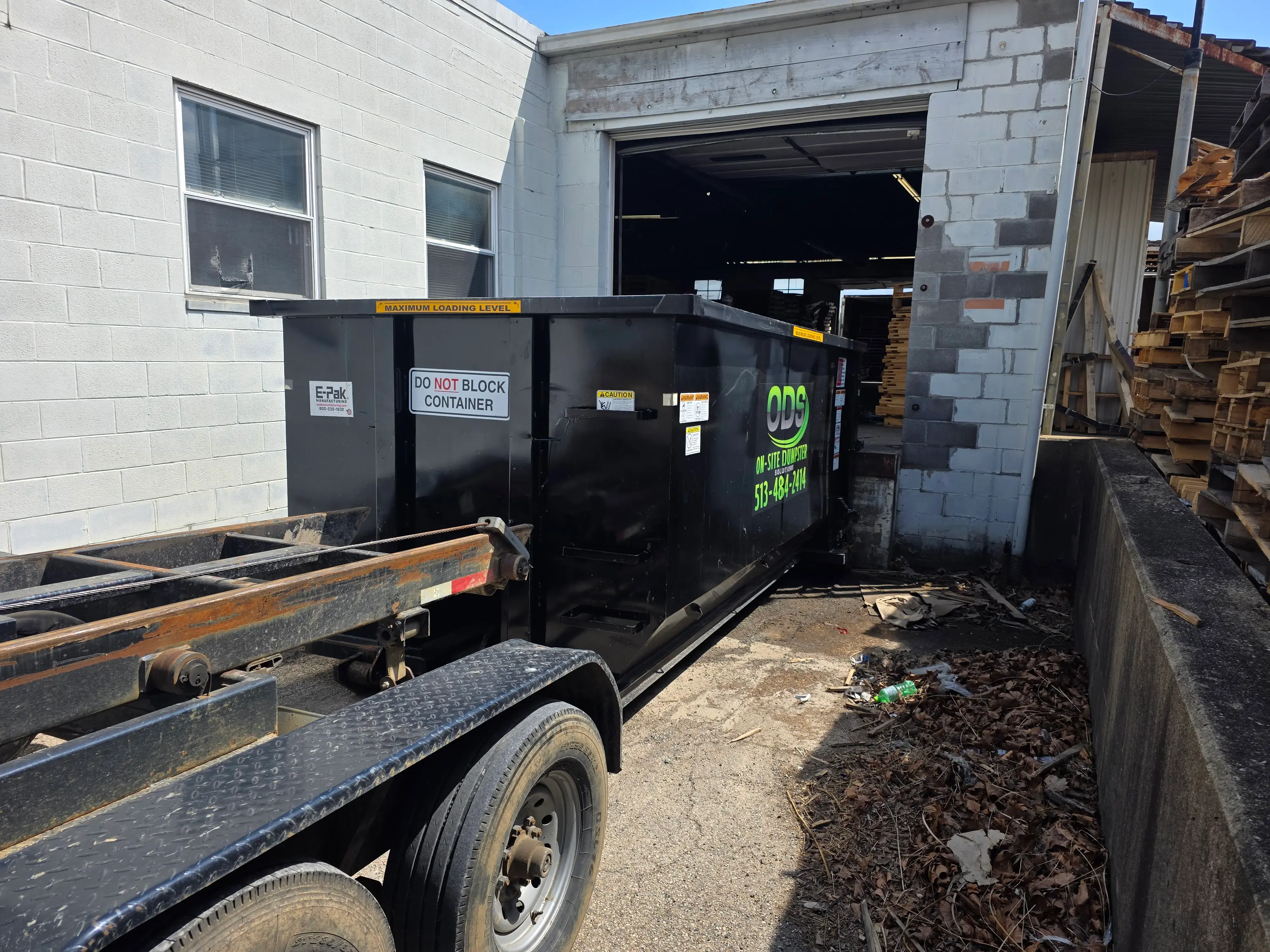 ODS roll-off dumpster placed in a narrow Hamilton driveway